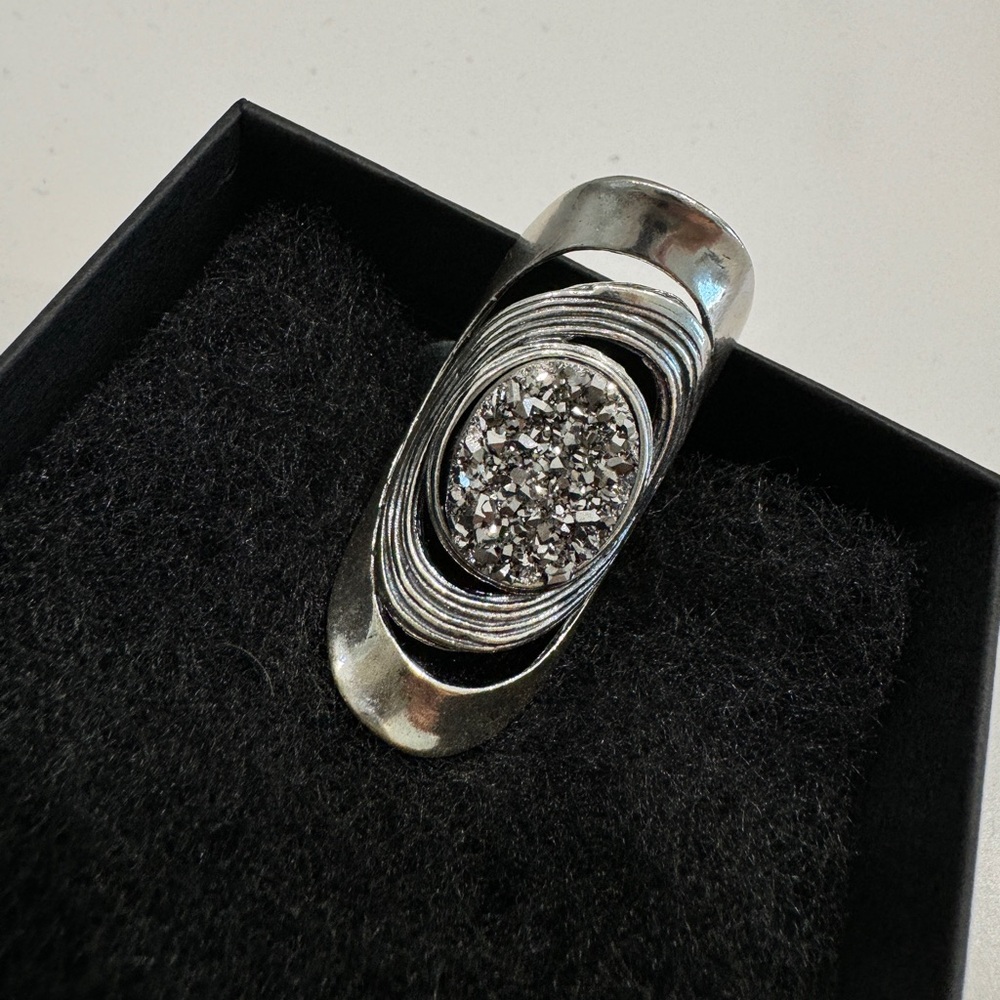 Silver ring with gemstone.